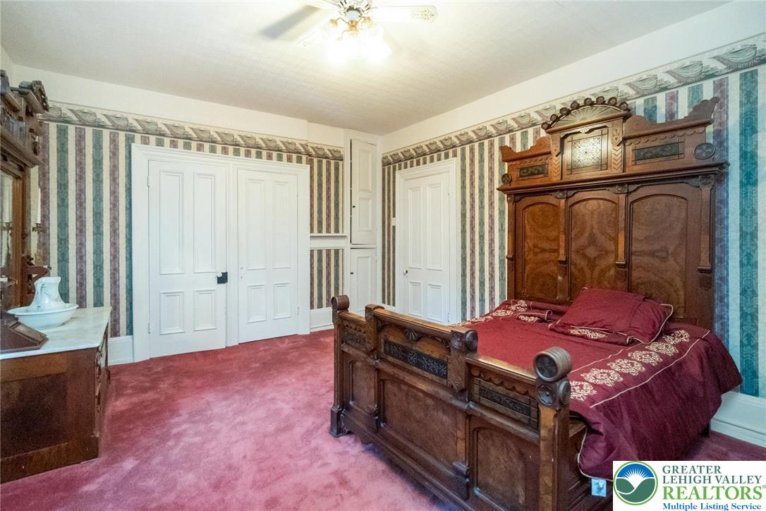 11 East Front Street Jim Thorpe, PA 18229 - Photo 58 of 63 a bedroom with a bed and wooden floor