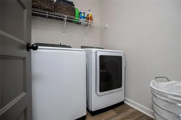 a spacious bedroom with a bed and a chandelier