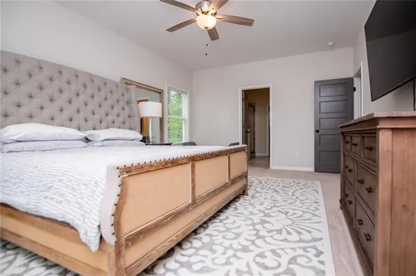a room with a wooden floor and a bathroom