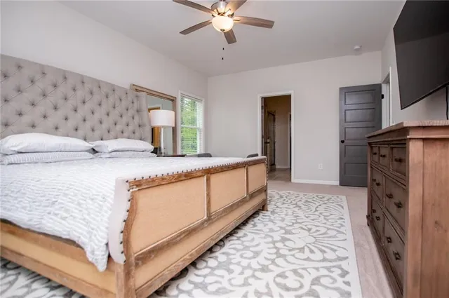 a room with a wooden floor and a bathroom