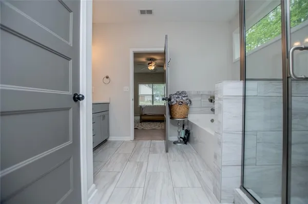 a bathroom with a double vanity sink and a mirror