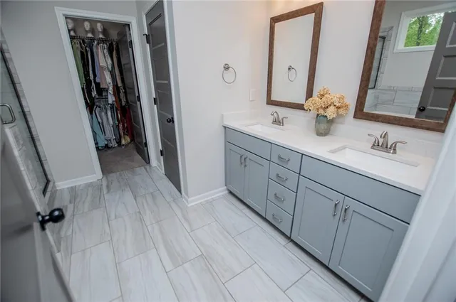 a bathroom with a tub shower and window