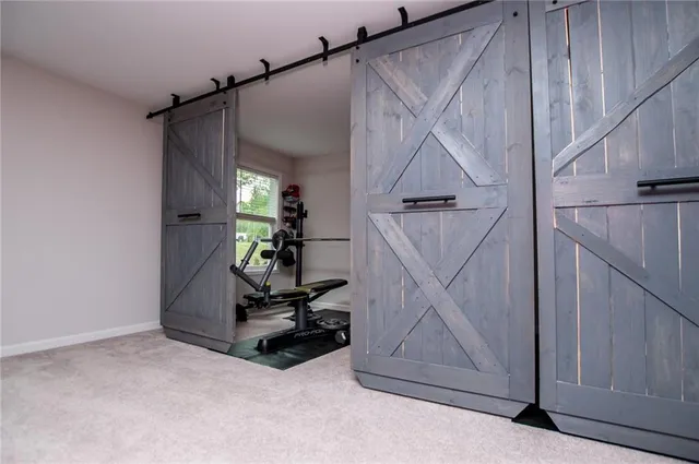 an aerial view of a house with swimming pool and porch