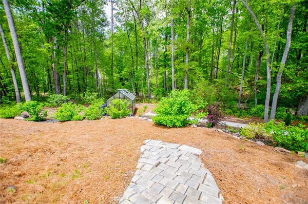 a backyard of a house with lots of green space