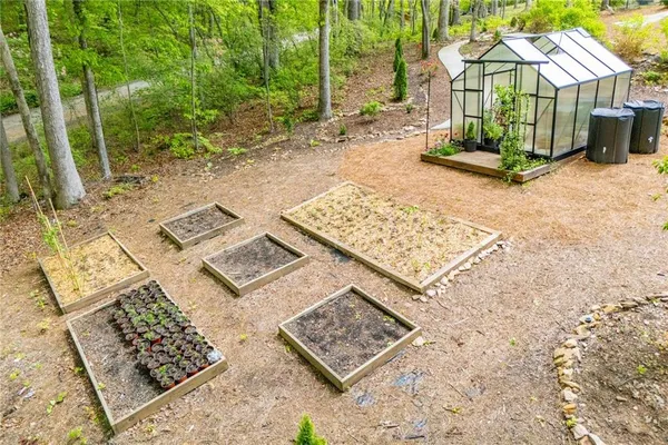 a front view of a house with a yard and seating space