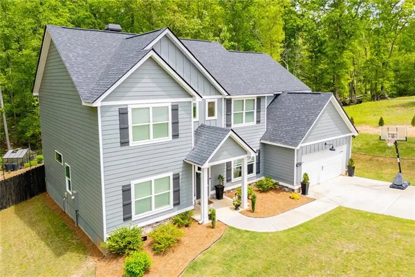 a view of a livingroom with furniture and hardwood floor