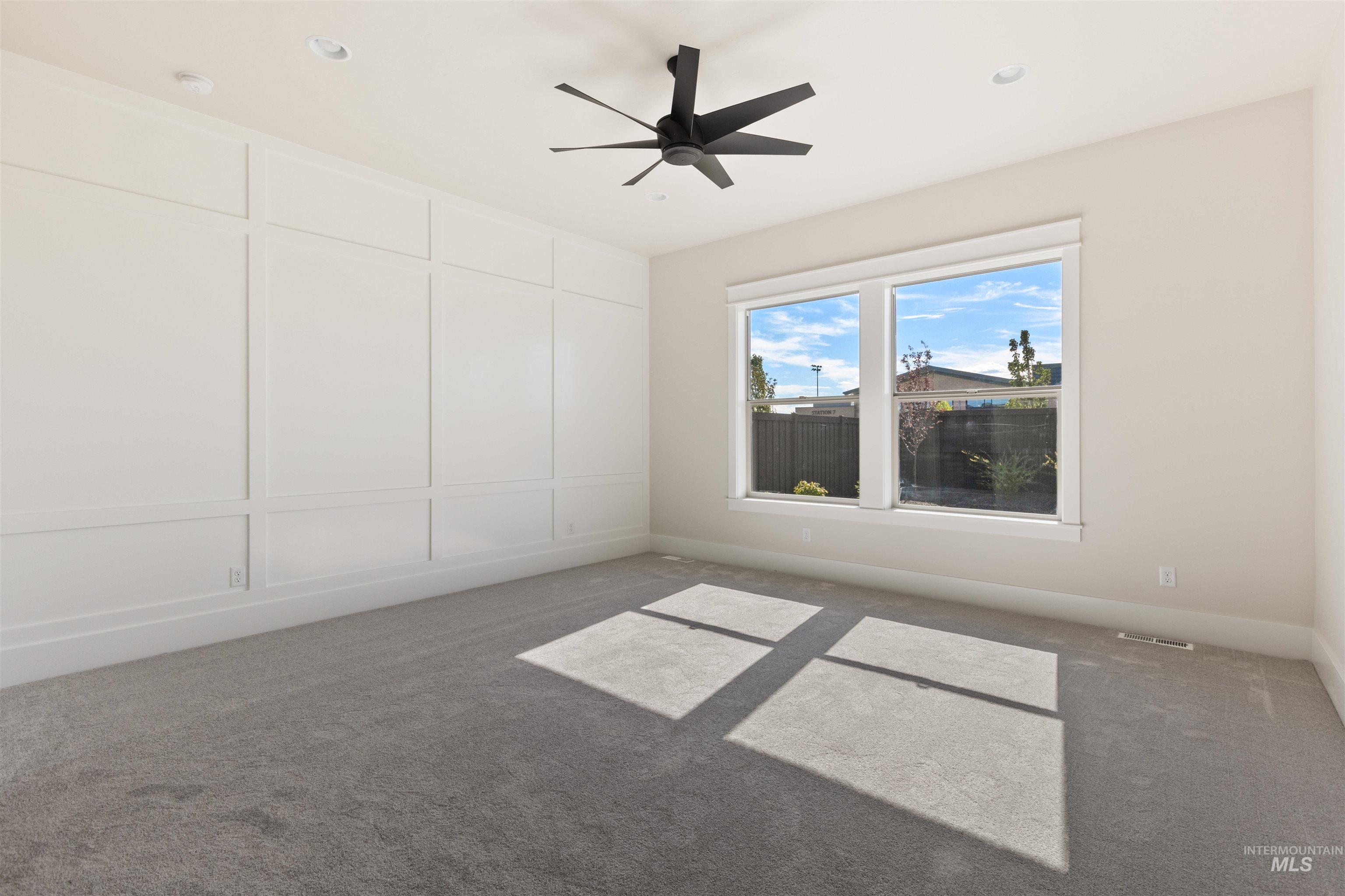 5857 South Highmark Avenue Meridian, ID 83642 - Photo 14 of 37 Empty room with carpet floors and a ceiling fan