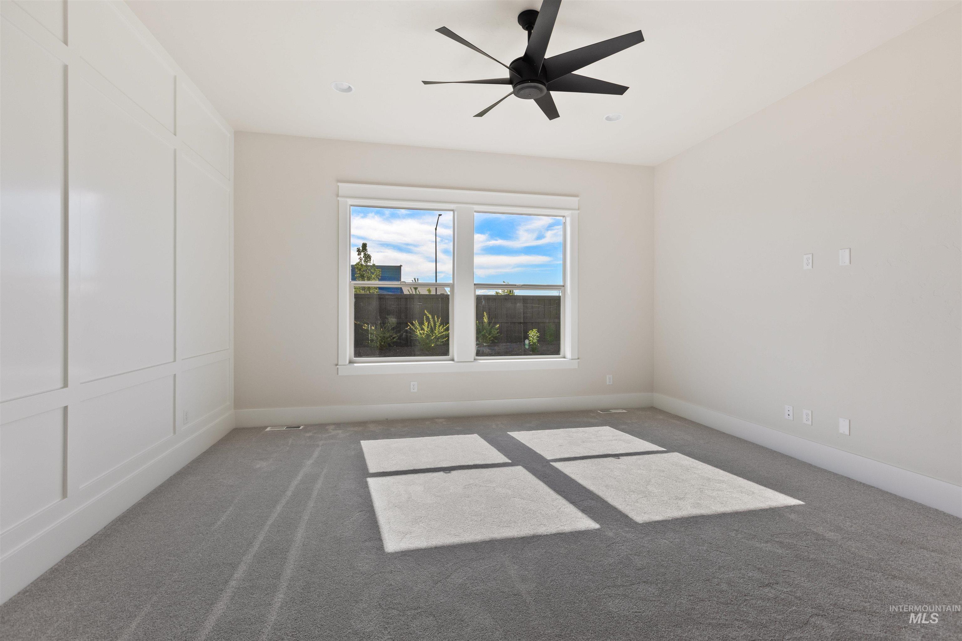 5857 South Highmark Avenue Meridian, ID 83642 - Photo 16 of 37 Carpeted empty room featuring a ceiling fan and baseboards