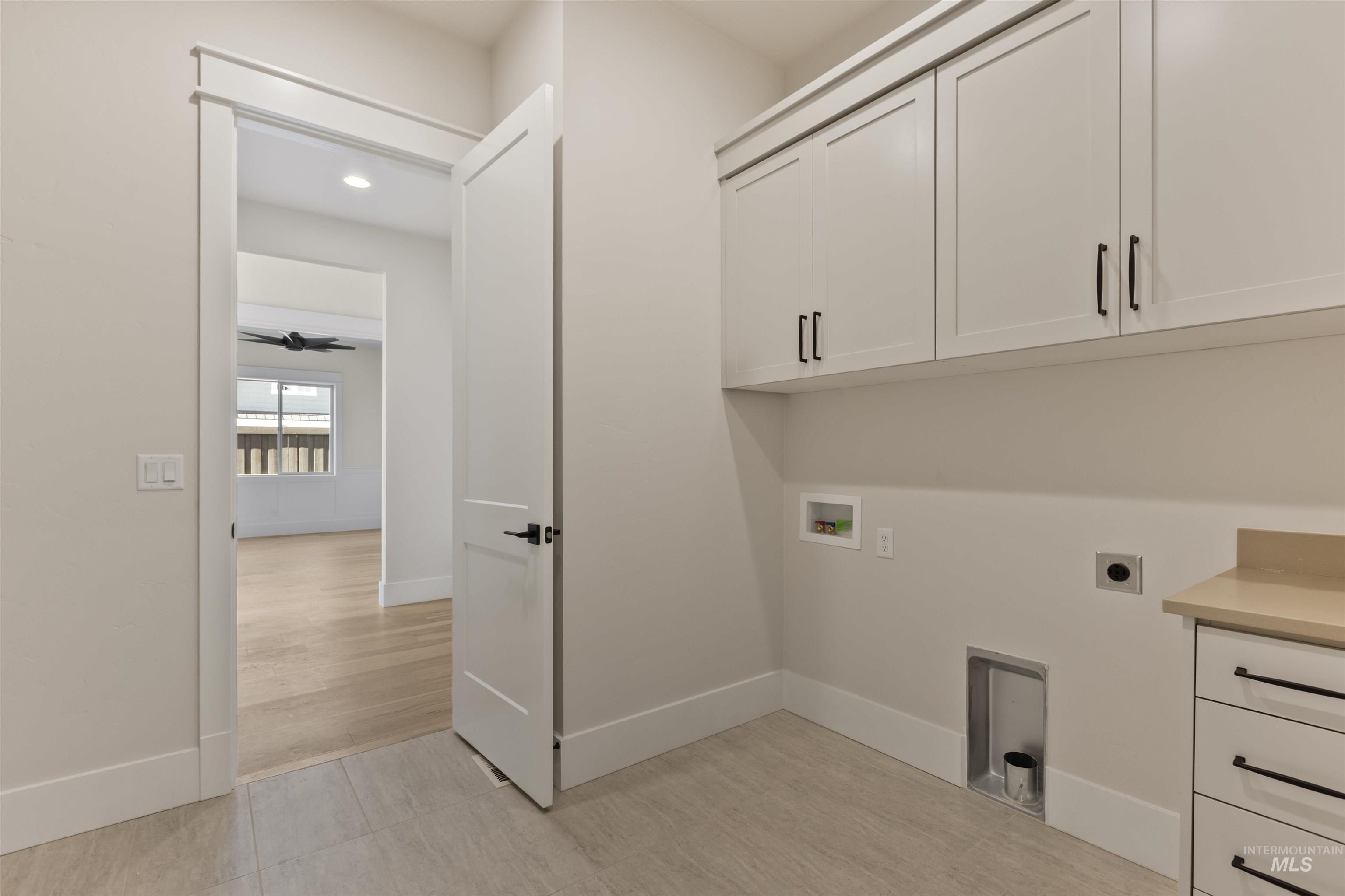 5857 South Highmark Avenue Meridian, ID 83642 - Photo 24 of 37 Laundry room with electric dryer hookup, cabinet space, hookup for a washing machine, and recessed lighting