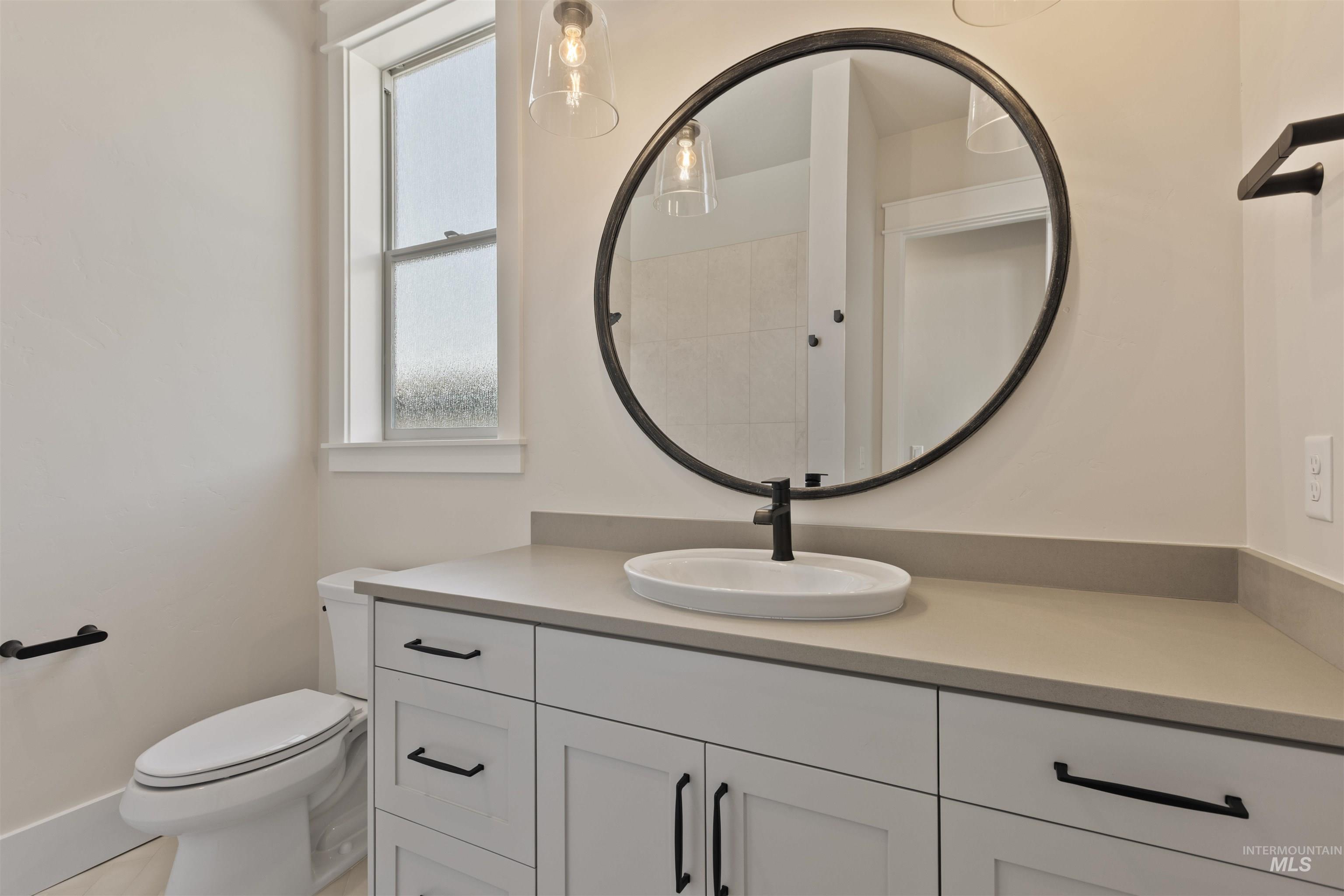 5857 South Highmark Avenue Meridian, ID 83642 - Photo 29 of 37 Full bath featuring vanity and toilet