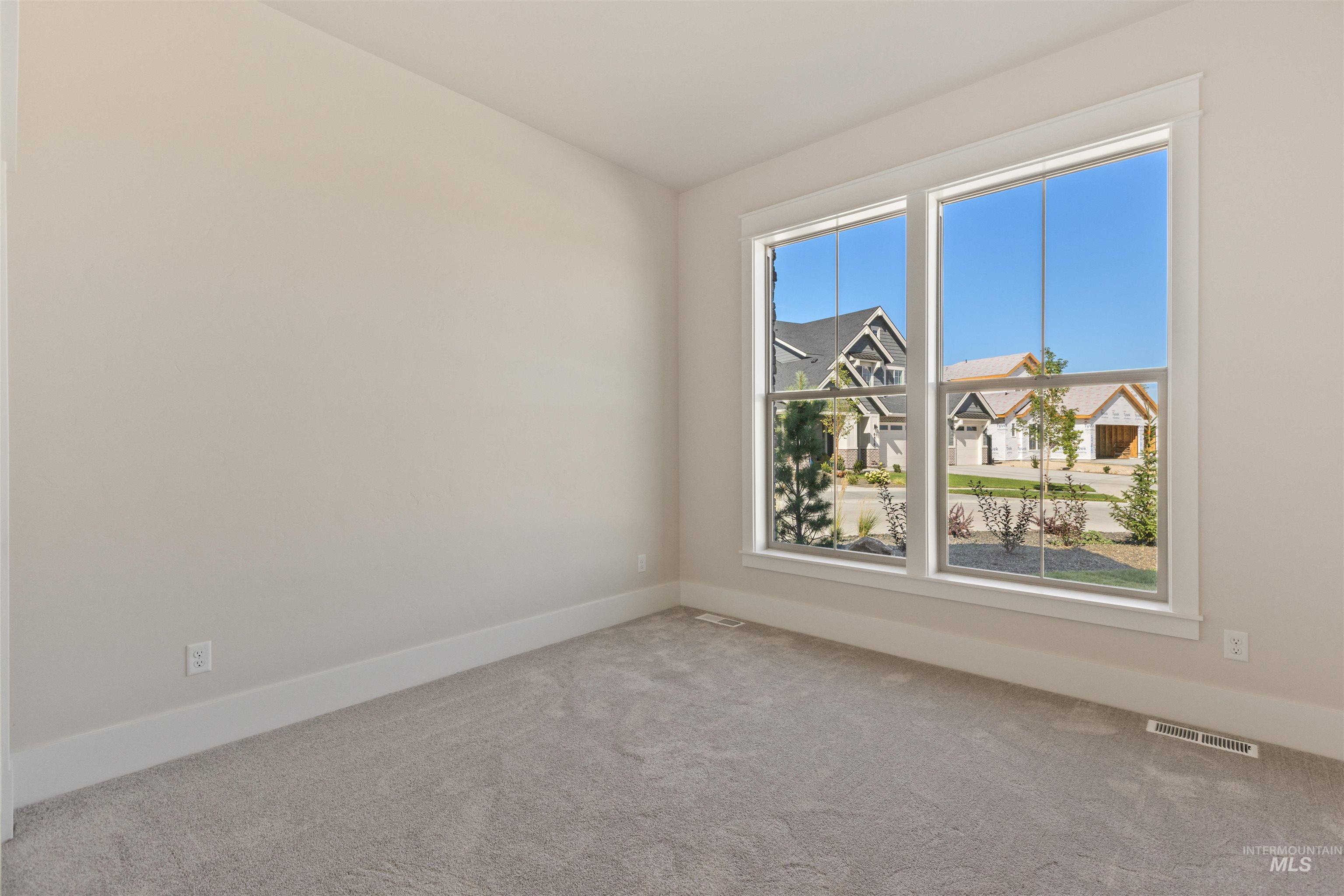 5857 South Highmark Avenue Meridian, ID 83642 - Photo 30 of 37 Carpeted spare room with baseboards