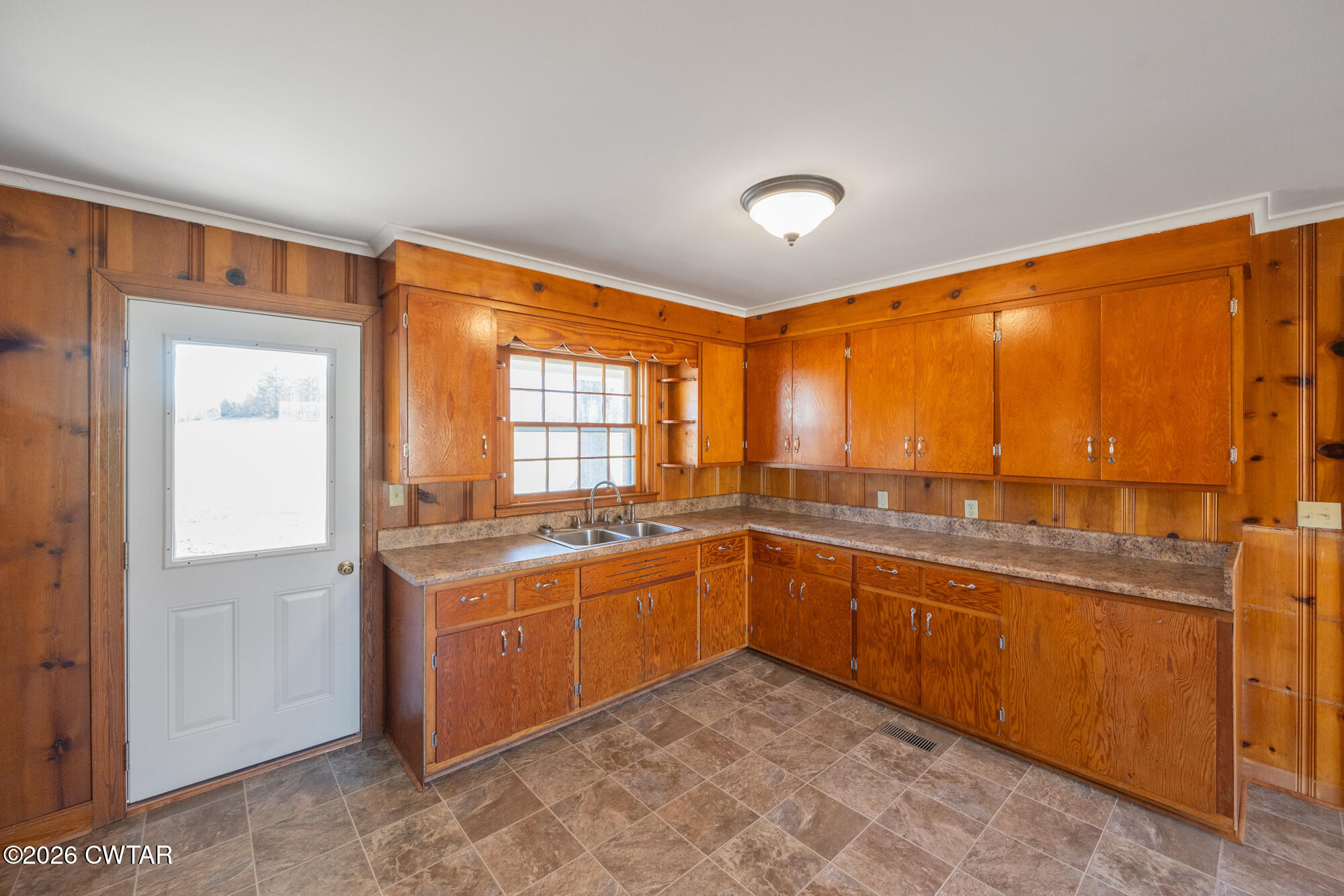 18810 West Main Street Huntingdon, TN 38344 - Photo 11 of 34 a large kitchen with a sink and large window