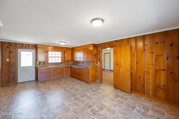 a large kitchen with a large window