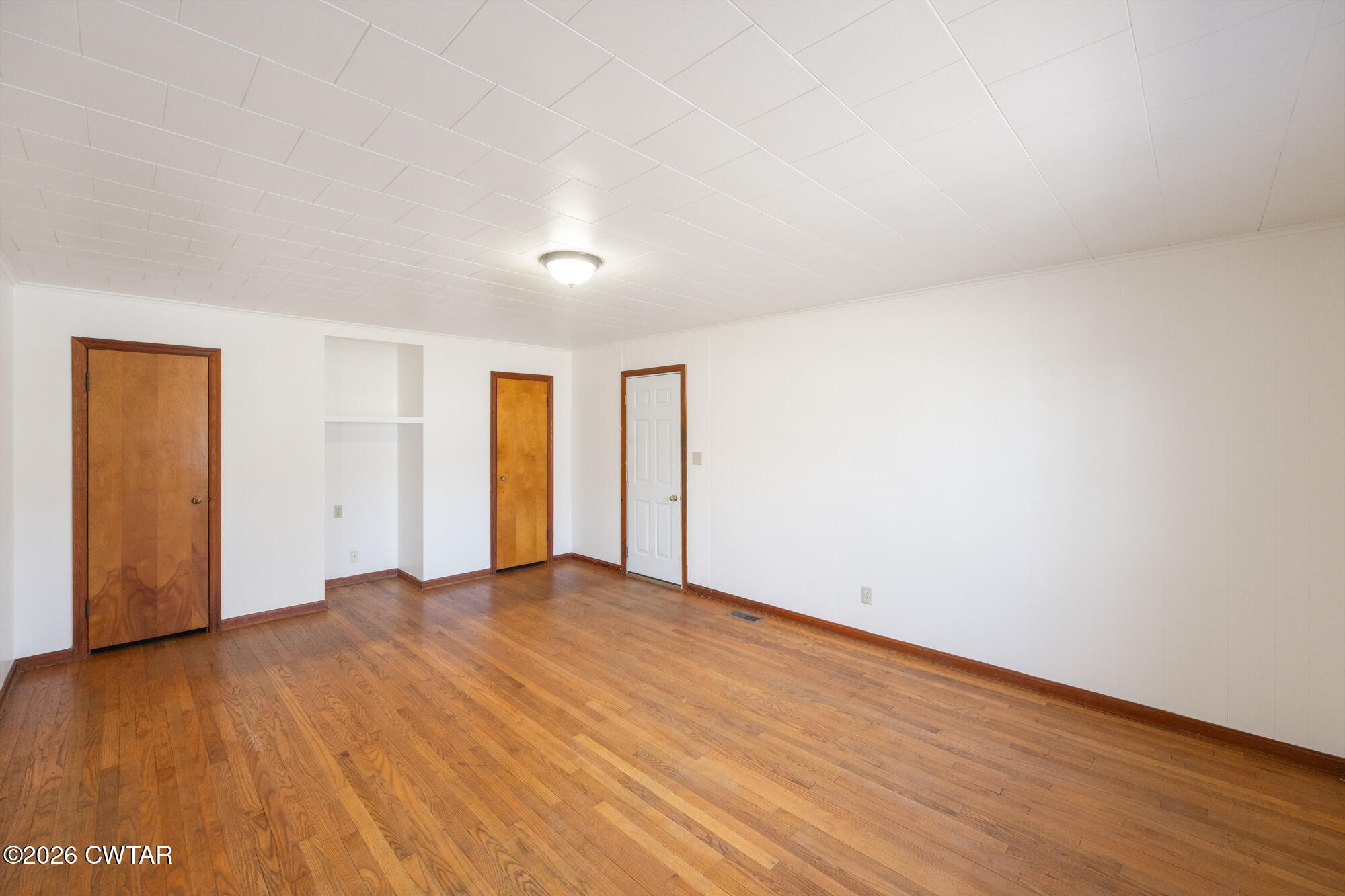 18810 West Main Street Huntingdon, TN 38344 - Photo 15 of 34 a view of an empty room with wooden floor