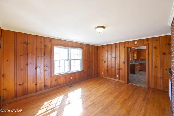 a view of an empty room with a window