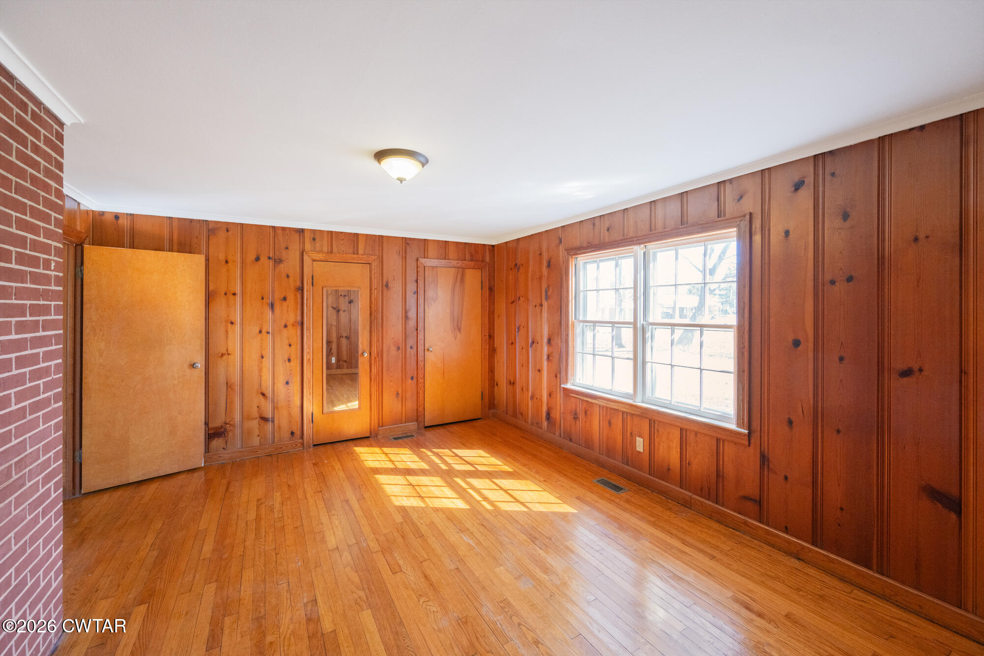 18810 West Main Street Huntingdon, TN 38344 - Photo 20 of 34 wooden floor in an empty room with a window