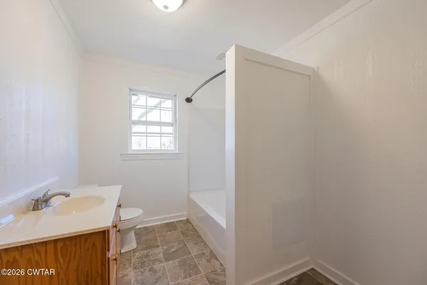a bathroom with a sink and toilet