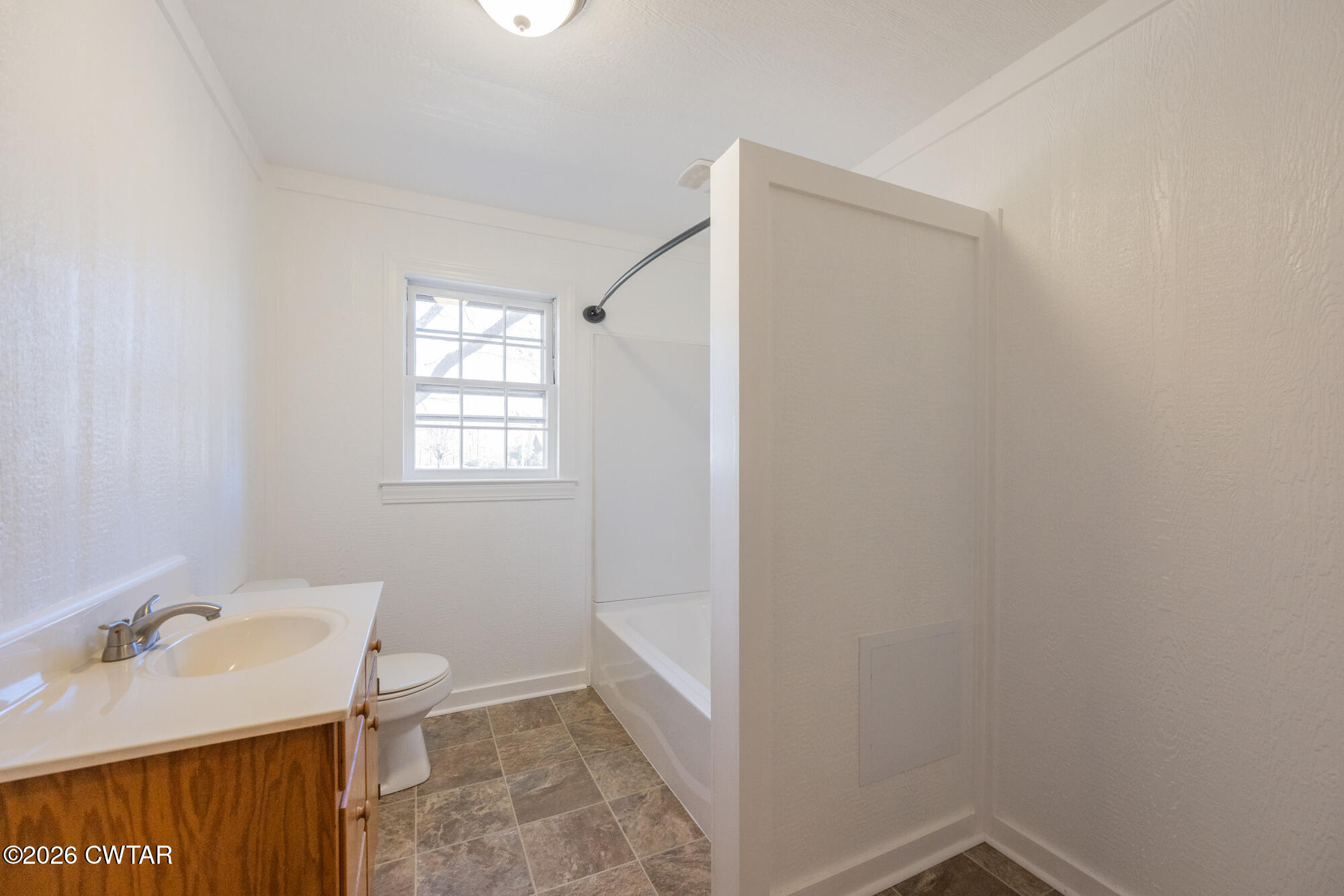 18810 West Main Street Huntingdon, TN 38344 - Photo 21 of 34 a bathroom with a sink and toilet