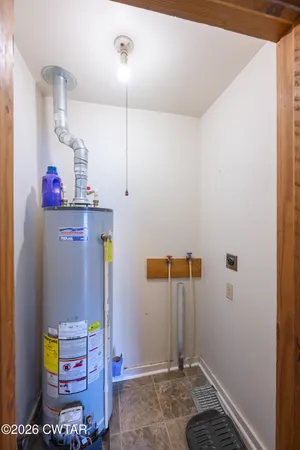 a view of storage and utility room with washer and dryer