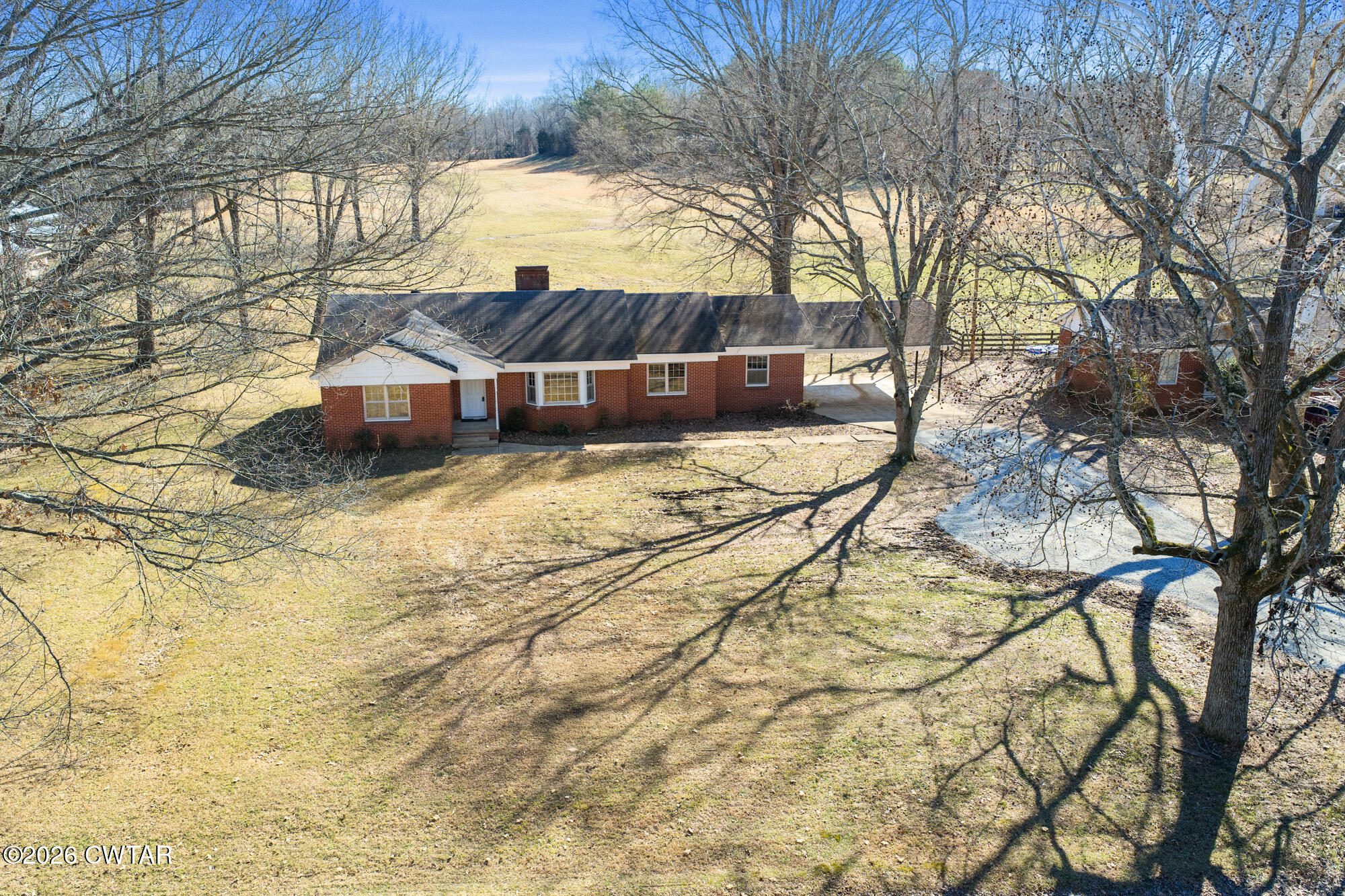 18810 West Main Street Huntingdon, TN 38344 - Photo 30 of 34 a view of a yard with a large tree
