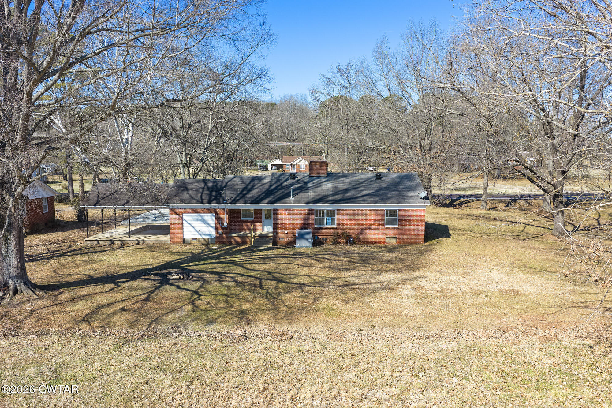 18810 West Main Street Huntingdon, TN 38344 - Photo 3 of 34 a view of a dry yard with trees
