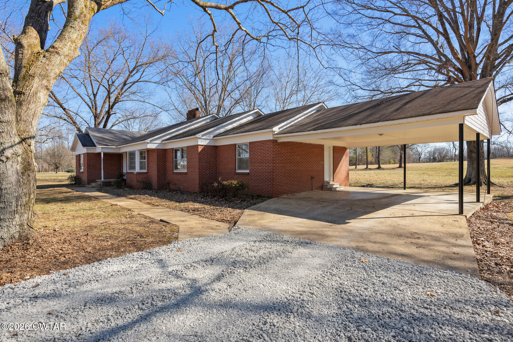 18810 West Main Street Huntingdon, TN 38344 - Photo 5 of 34 a house with trees in front of it