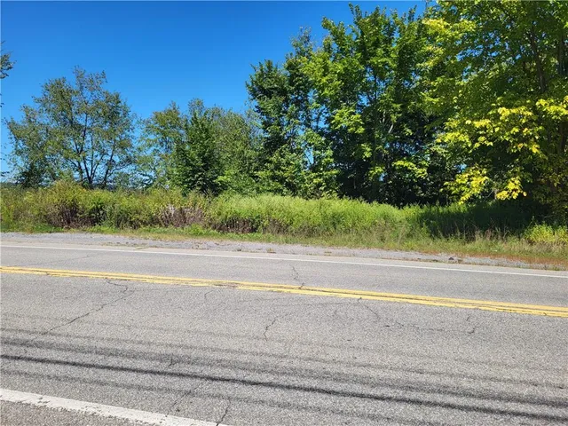 a view of a yard and ocean view