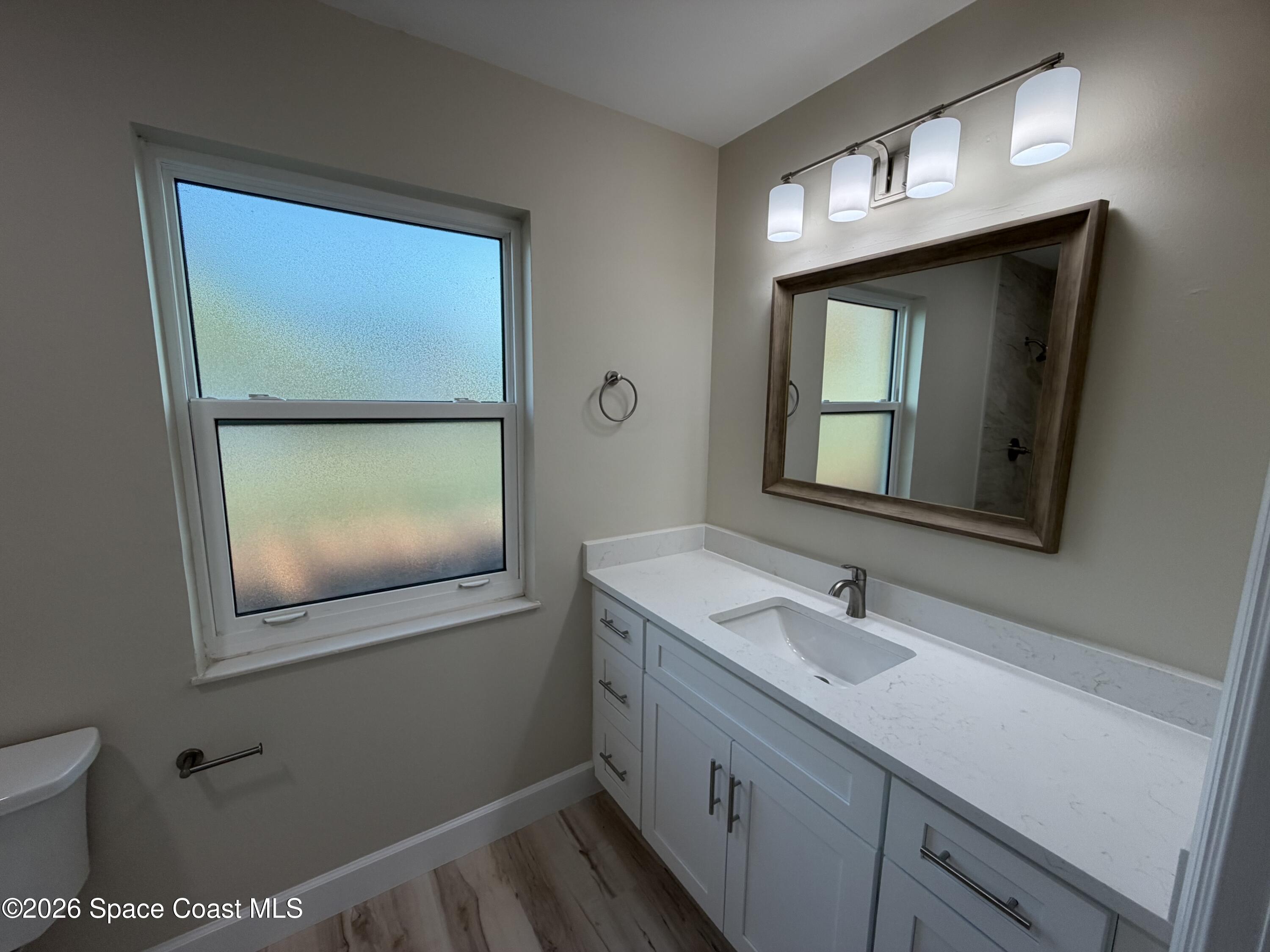 137 Concha Drive Sebastian, FL 32958 - Photo 16 of 29 a bathroom with a sink a vanity and a mirror