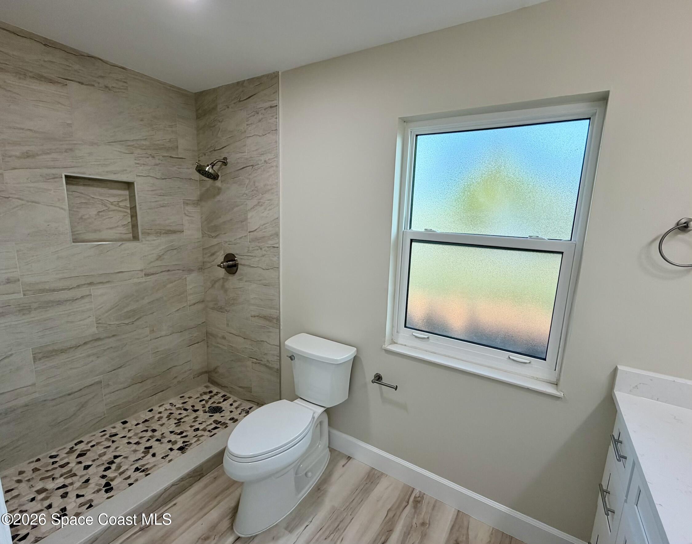 137 Concha Drive Sebastian, FL 32958 - Photo 17 of 29 a bathroom with a toilet and a shower