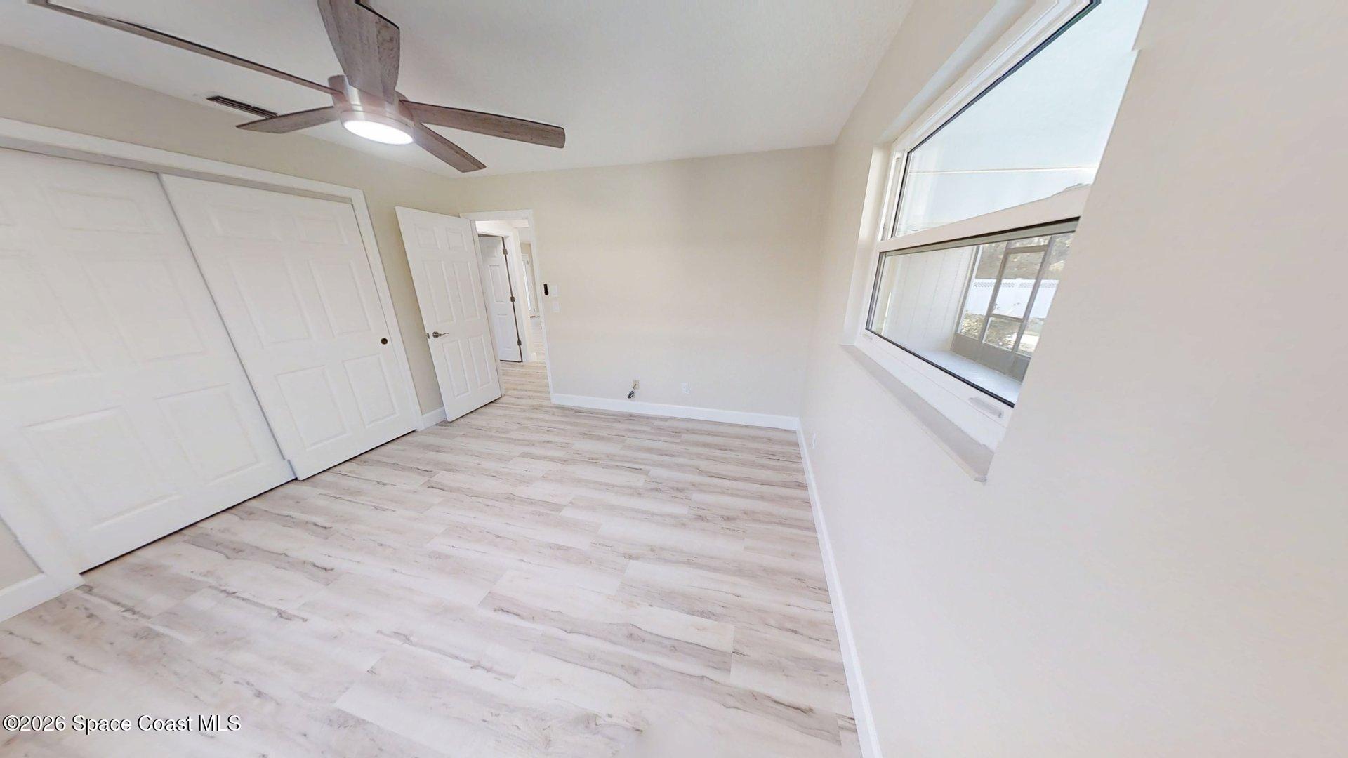 137 Concha Drive Sebastian, FL 32958 - Photo 20 of 29 a view of an empty room with cabinet and a window