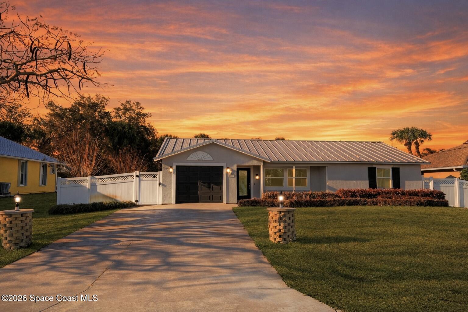 137 Concha Drive Sebastian, FL 32958 - Photo 2 of 29 a front view of a house with a yard