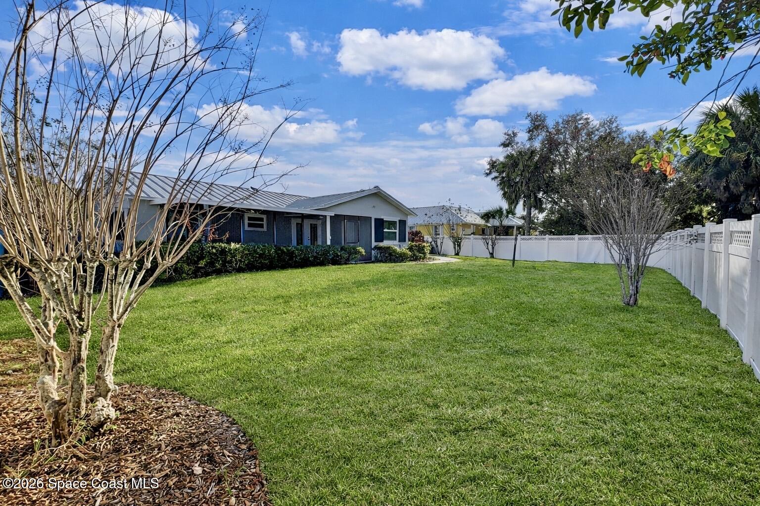 137 Concha Drive Sebastian, FL 32958 - Photo 25 of 29 a view of a house with a yard
