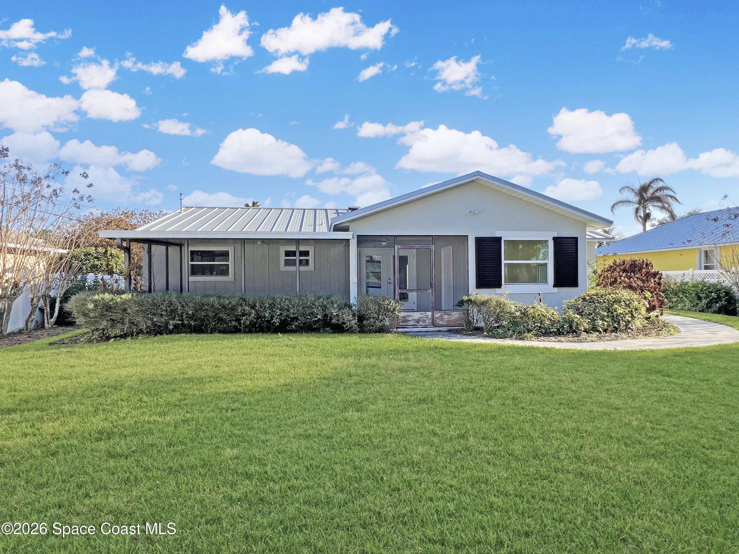 137 Concha Drive Sebastian, FL 32958 - Photo 27 of 29 a front view of a house with garden