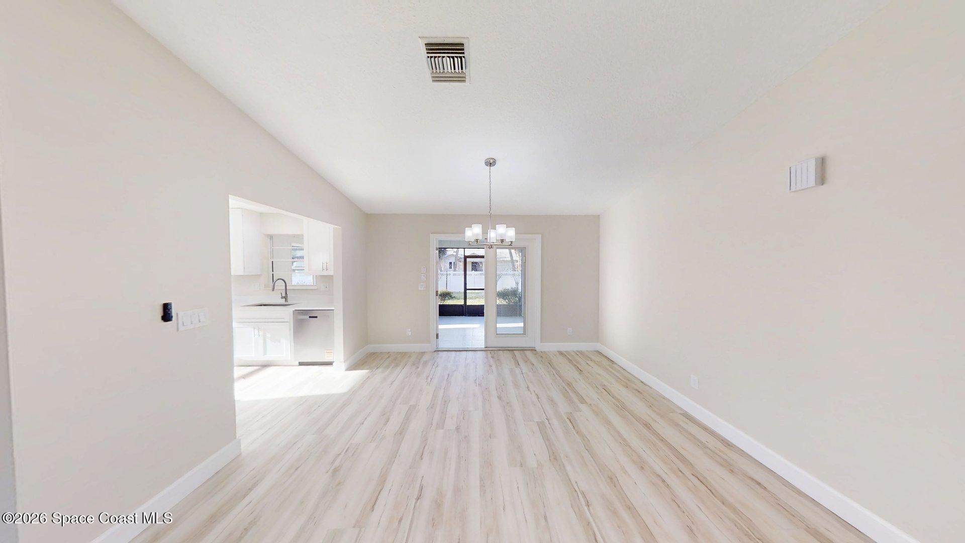 137 Concha Drive Sebastian, FL 32958 - Photo 7 of 29 a view of livingroom with kitchen
