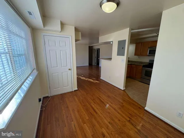 a view of entryway with wooden floor