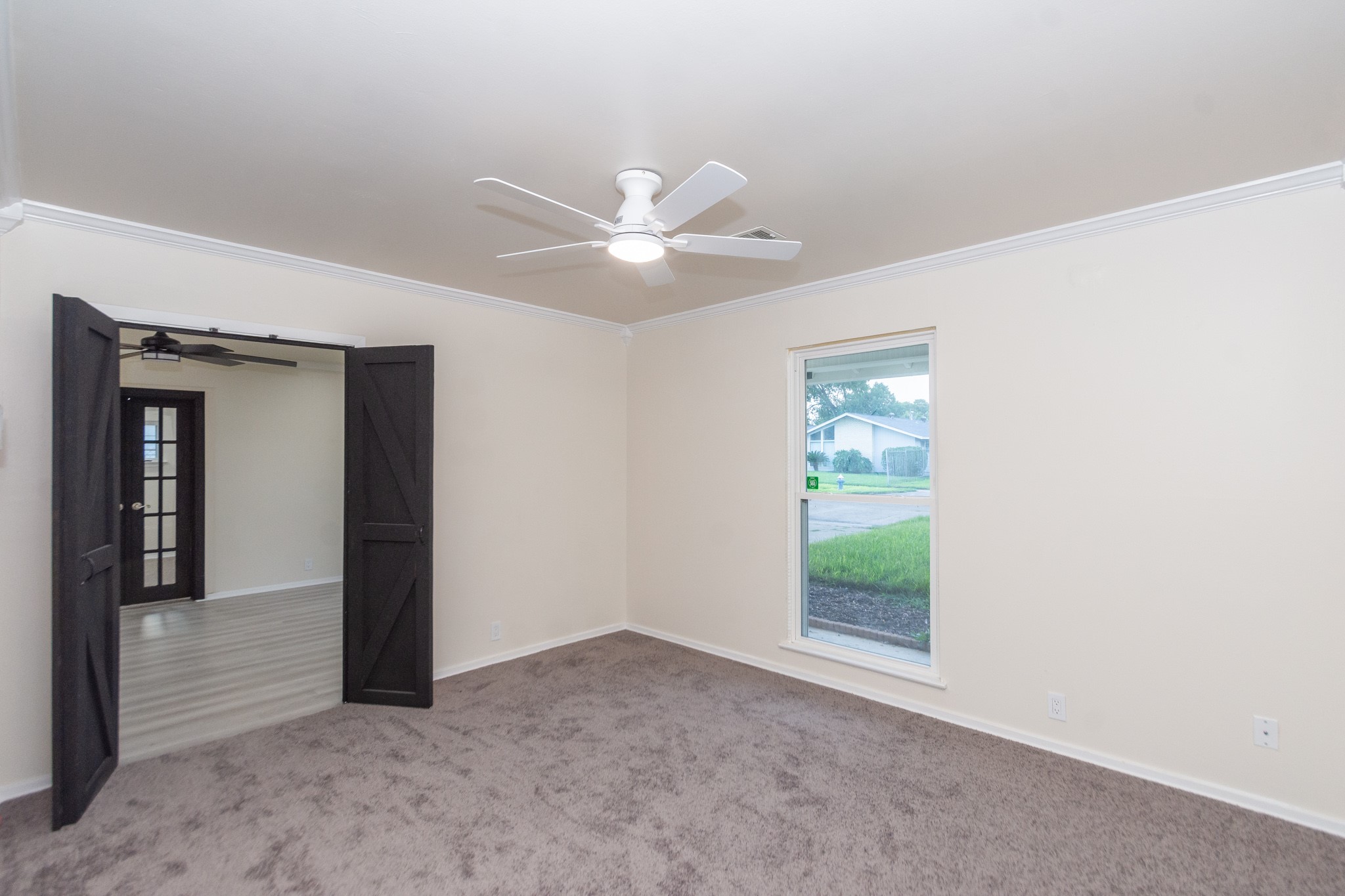 5834 Overdale Street Houston, TX 77033 - Photo 13 of 18 a view of an empty room with a window