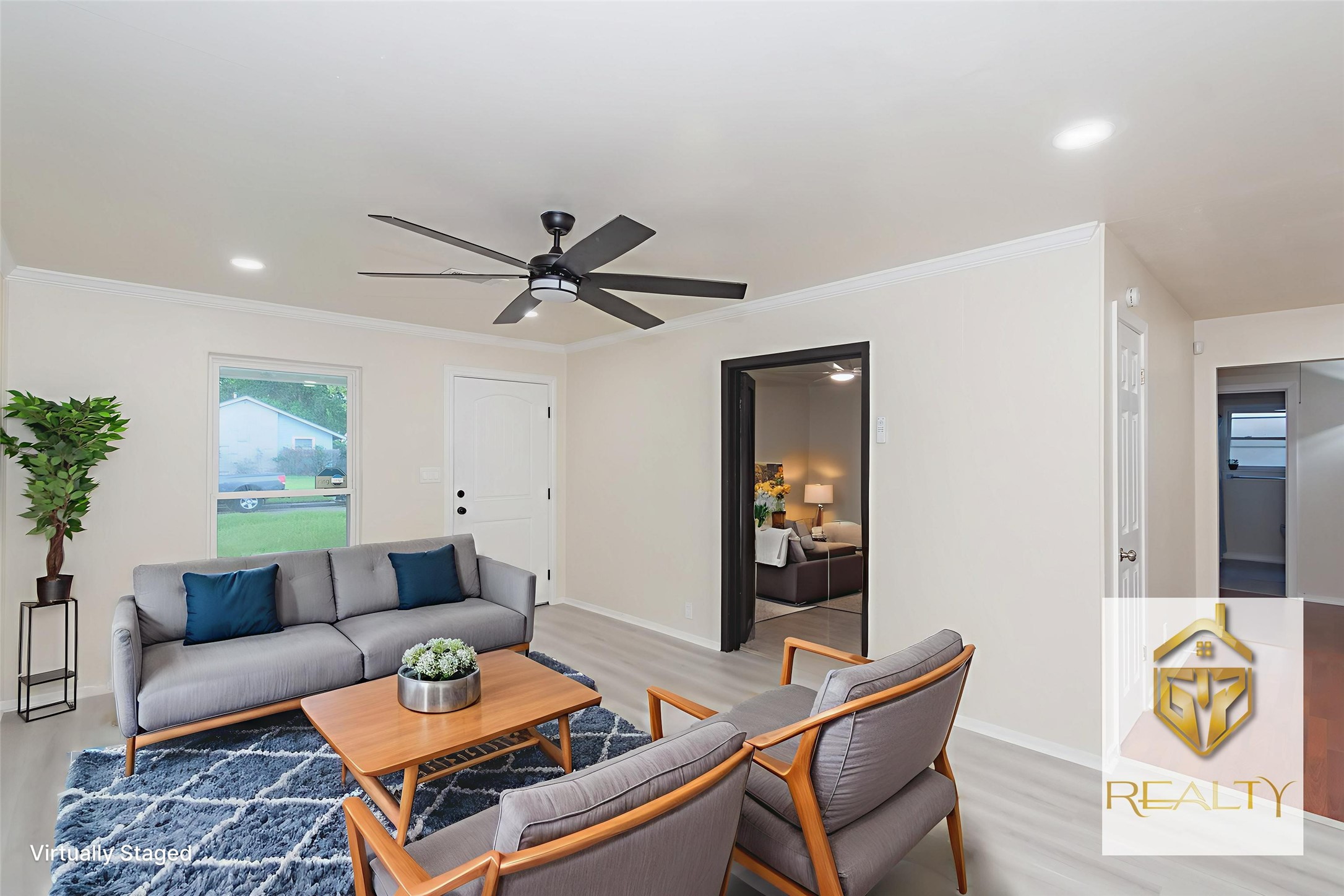 5834 Overdale Street Houston, TX 77033 - Photo 3 of 18 a living room with furniture and a window