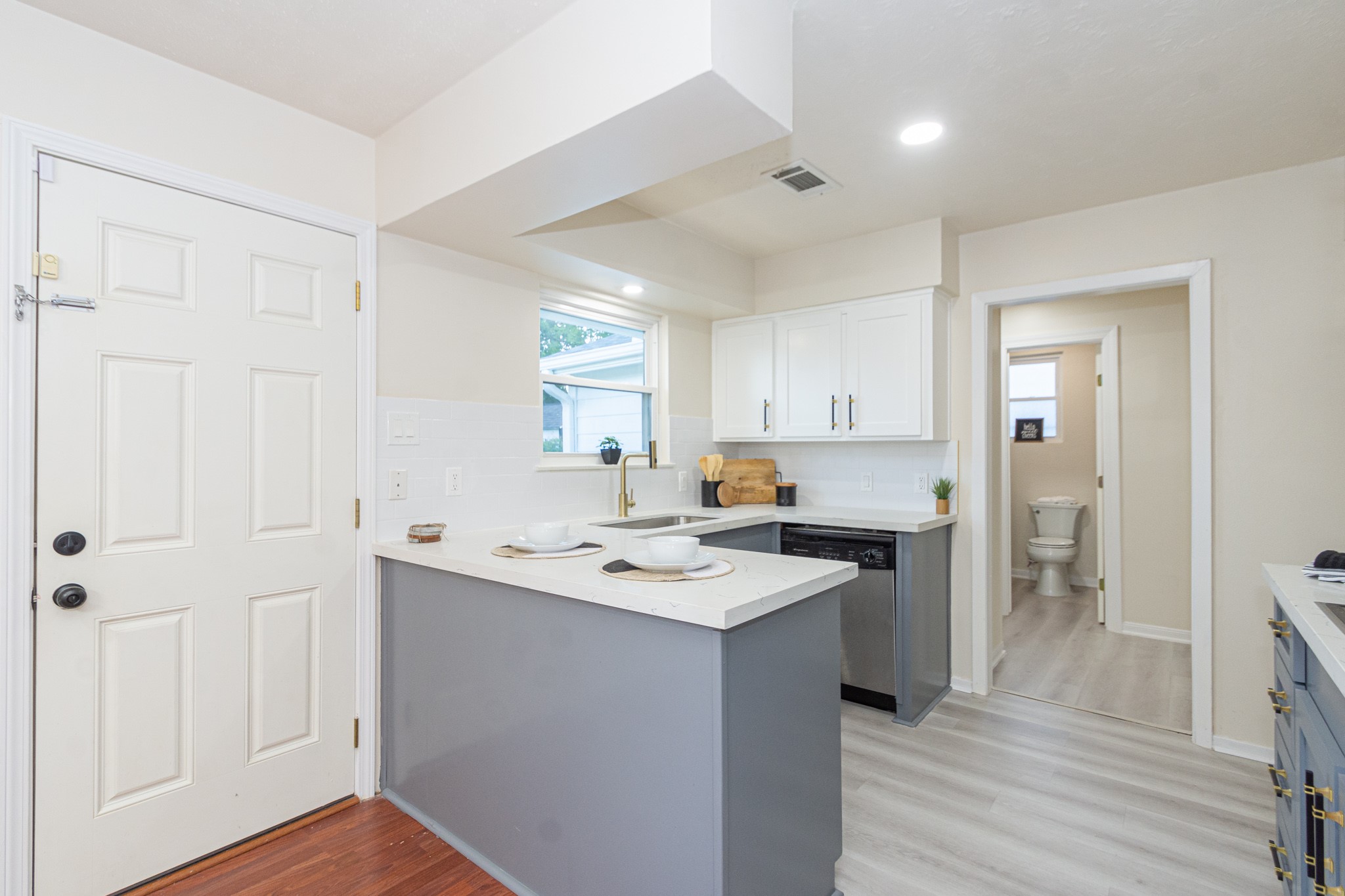 5834 Overdale Street Houston, TX 77033 - Photo 7 of 18 a kitchen with a sink stove and cabinets
