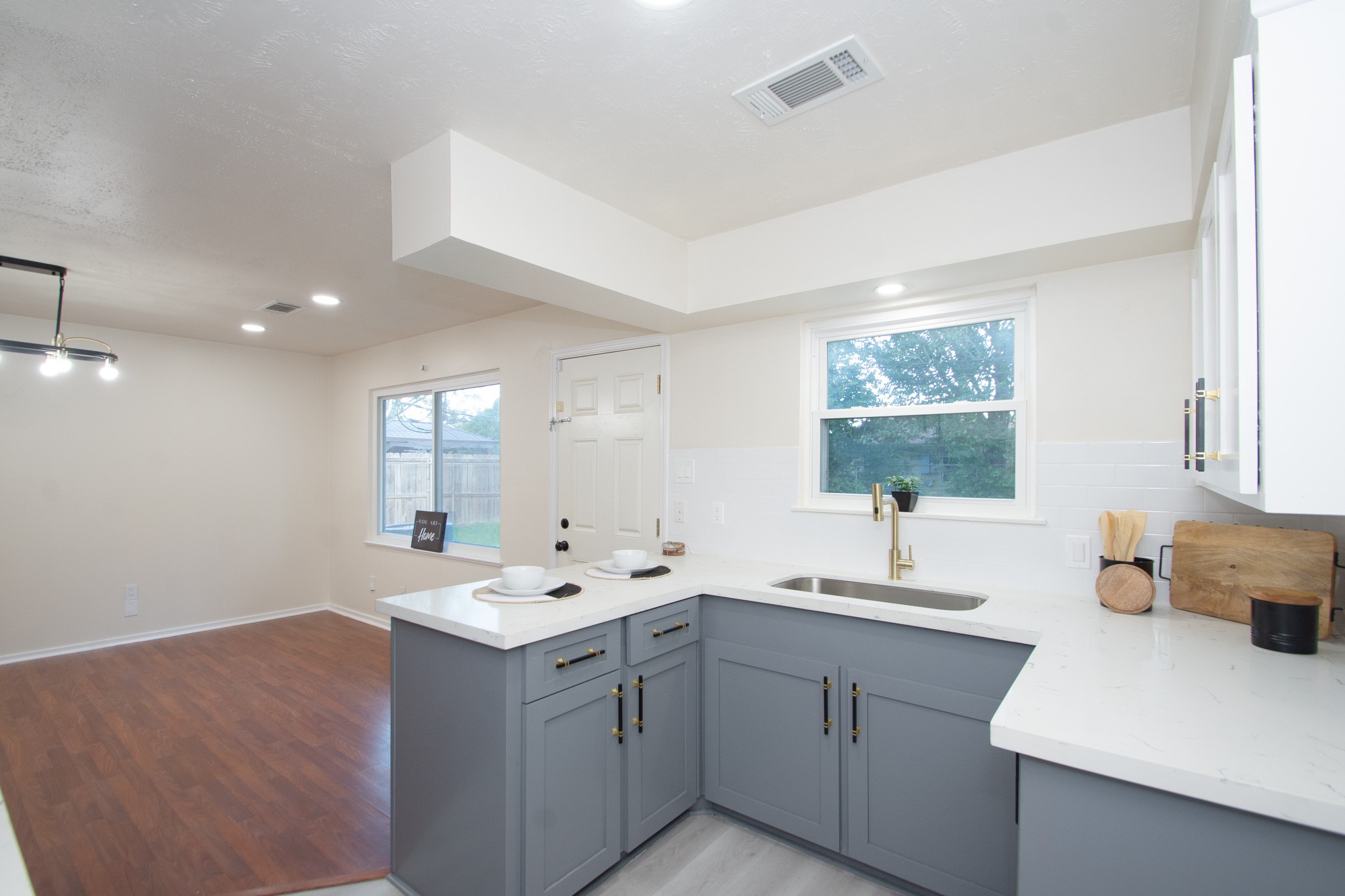 5834 Overdale Street Houston, TX 77033 - Photo 9 of 18 a kitchen that has a sink a window and a counter space