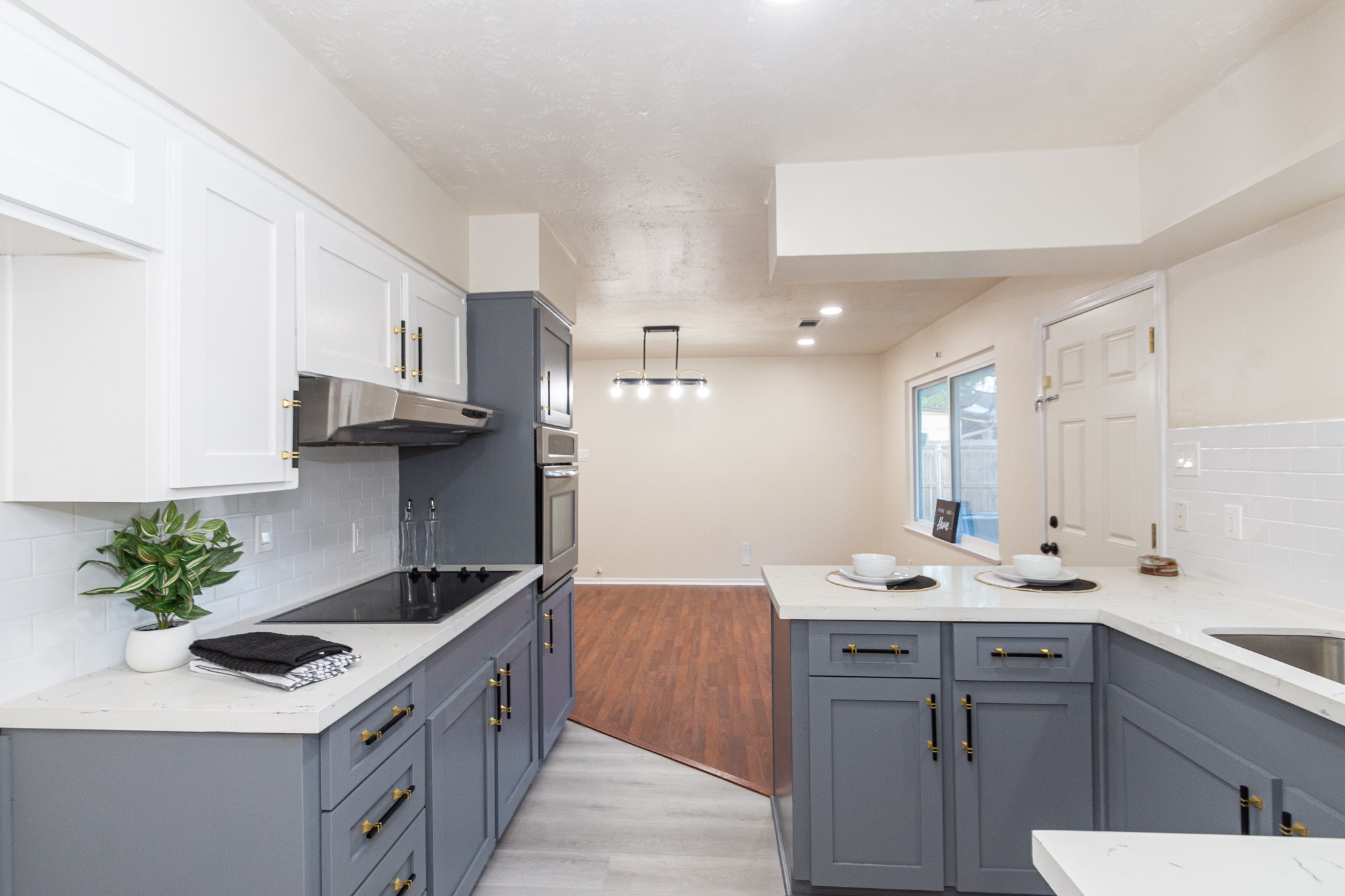 5834 Overdale Street Houston, TX 77033 - Photo 10 of 18 a kitchen with a sink stove and cabinets