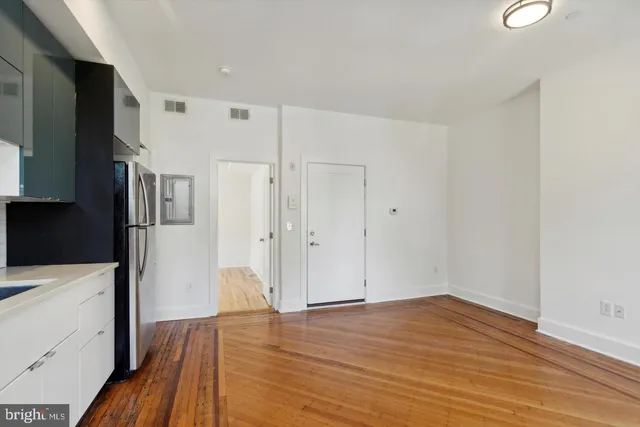 a view of a kitchen from the hallway