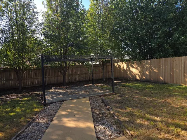 a backyard of a house with lots of green space