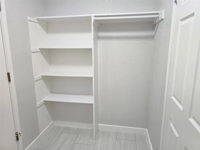 a view of an empty walk in closet