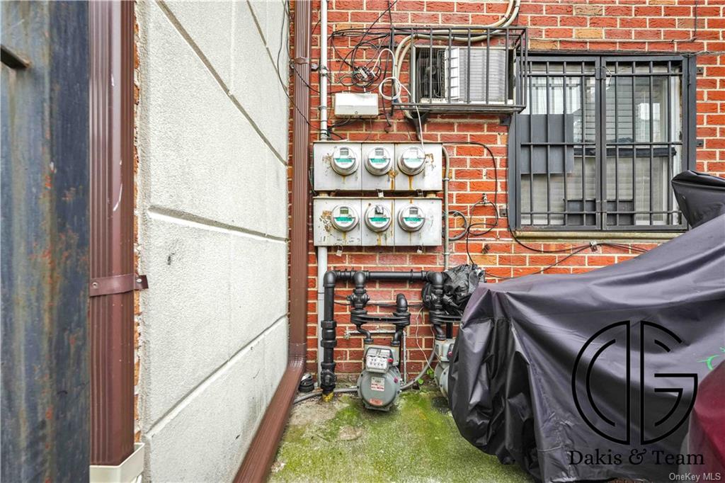 11-46 Welling Court Queens, NY 11102 - Photo 3 of 9 a utility room with dryer and washer