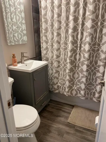 a bathroom with a toilet and a sink