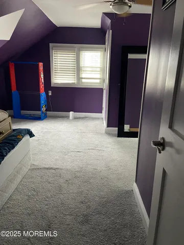 a view of hall way with furniture