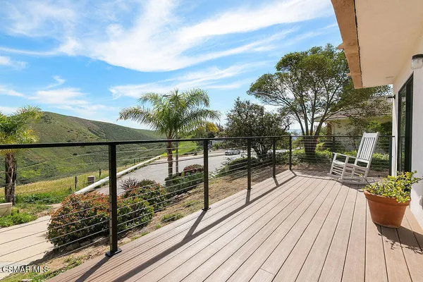 a view of balcony with chairs