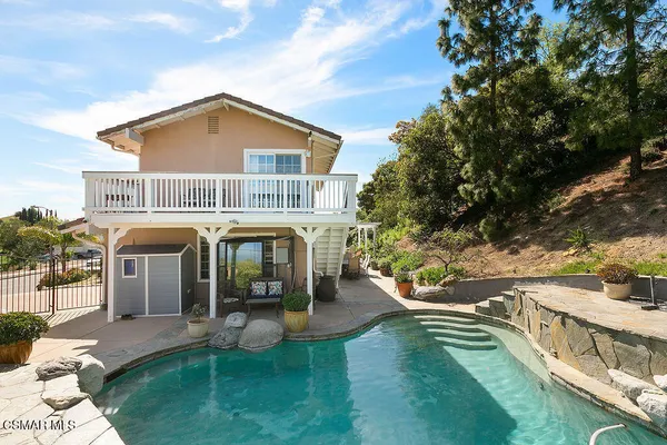 a bathroom with a sink a vanity and a mirror