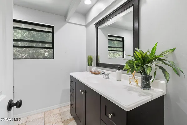 a bed room with a bed and a chair