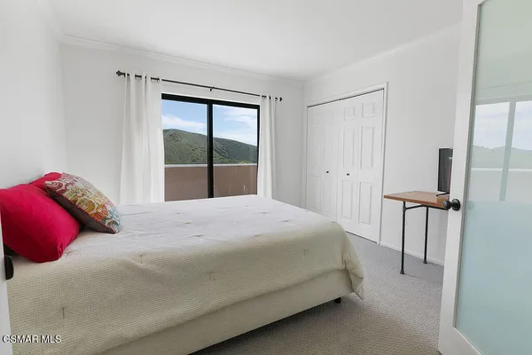 a view of balcony with furniture